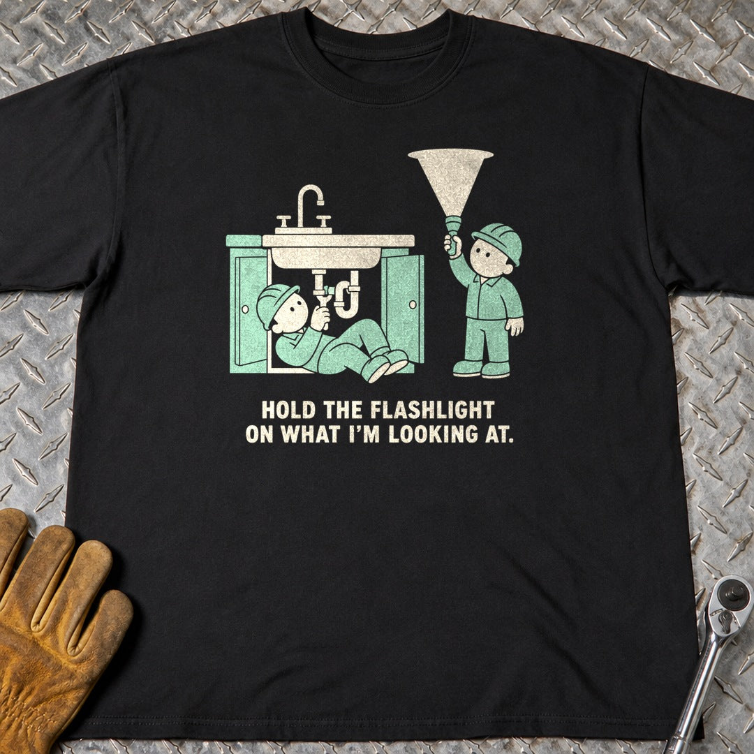Hold The Flashlight t-shirt flat lay